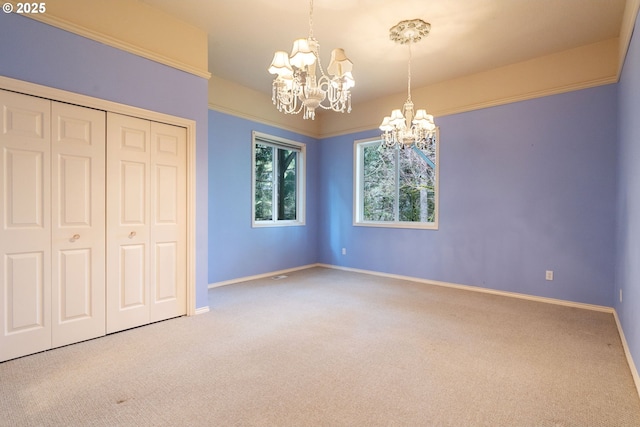 13581 SW Essex Dr, Portland, OR 97223 - unfurnished bedroom with a chandelier, carpet flooring, baseboards, and a closet