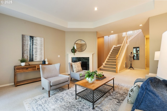 13581 SW Essex Dr, Portland, OR 97223 - living area with carpet floors, stairway, recessed lighting, a fireplace, and baseboards