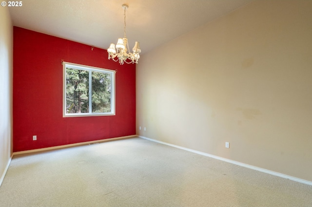 13581 SW Essex Dr, Portland, OR 97223 - spare room with a chandelier, carpet flooring, and baseboards