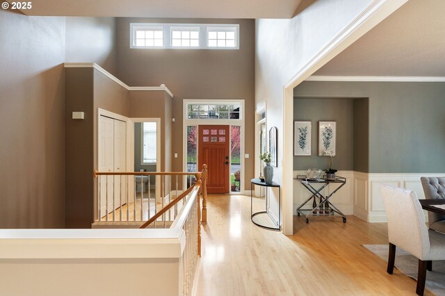 13581 SW Essex Dr, Portland, OR 97223 - entryway featuring a high ceiling, wood finished floors, and a wainscoted wall