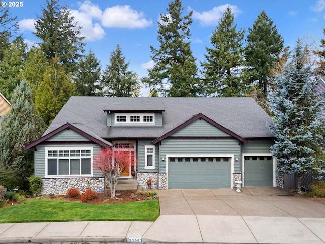 13581 SW Essex Dr, Portland, OR 97223 - craftsman-style house featuring stone siding, an attached garage, and a shingled roof