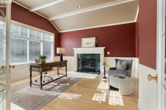 13581 SW Essex Dr, Portland, OR 97223 - office with lofted ceiling, wood finished floors, a fireplace, a wainscoted wall, and a decorative wall