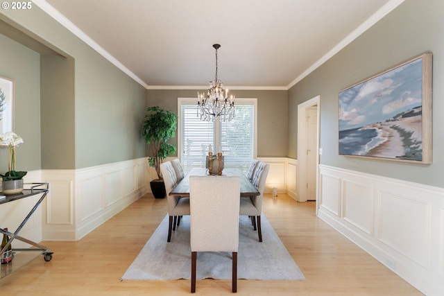 13581 SW Essex Dr, Portland, OR 97223 - dining room with a chandelier, light wood-type flooring, a wainscoted wall, a decorative wall, and ornamental molding