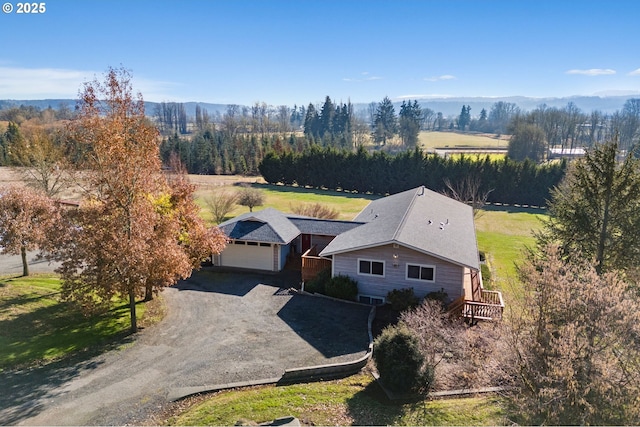 drone / aerial view featuring a mountain view and a rural view