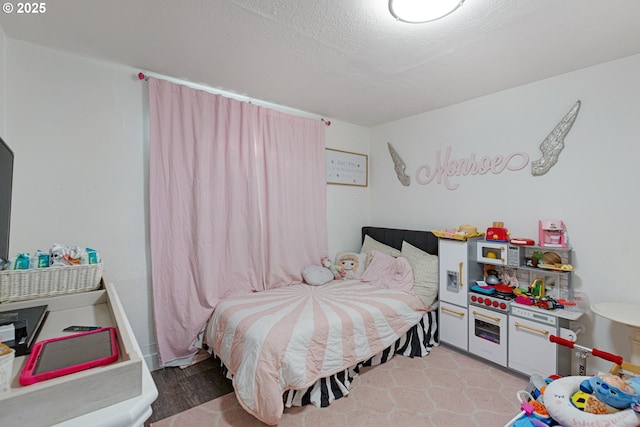 bedroom featuring a textured ceiling