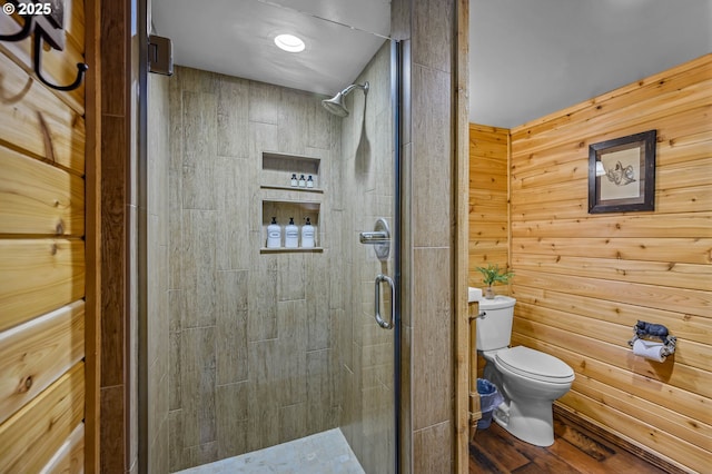 70202 Potato Bottom Rd, Lakeside, OR 97449 - bathroom with toilet, a shower stall, wood finished floors, and wooden walls