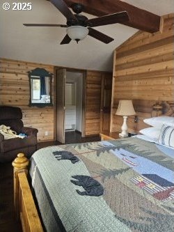 70202 Potato Bottom Rd, Lakeside, OR 97449 - bedroom featuring wood walls and ceiling fan