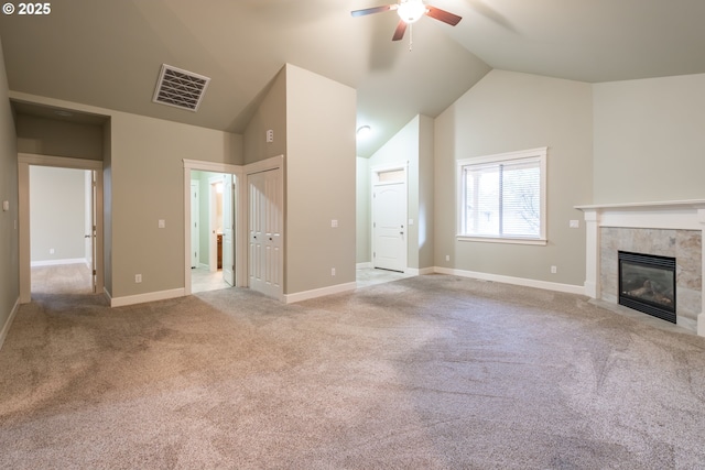 unfurnished living room featuring baseboards, a tiled fireplace, visible vents, and carpet flooring