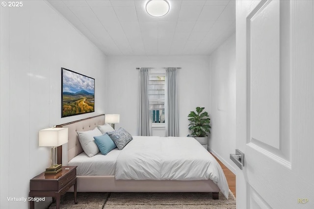 bedroom featuring wood finished floors