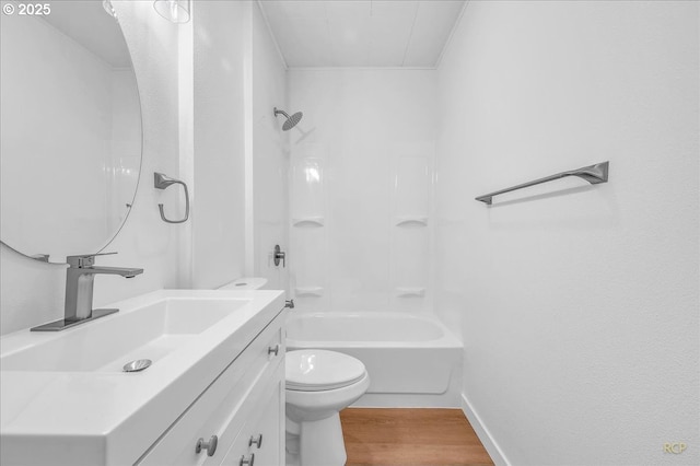 full bath featuring bathtub / shower combination, vanity, toilet, baseboards, and wood finished floors