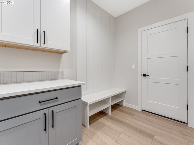 mudroom with light wood-style floors