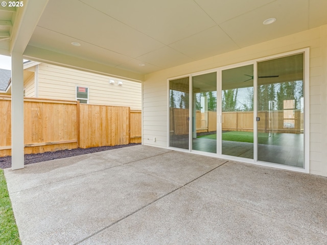 view of patio featuring fence