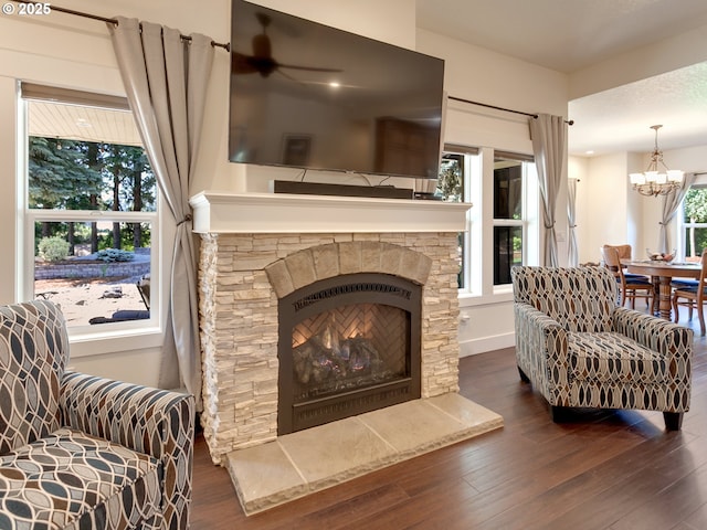 36280 SE Hauglum Rd, Boring, OR 97009 - living room featuring a chandelier, wood finished floors, and a fireplace