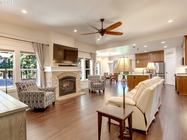 36280 SE Hauglum Rd, Boring, OR 97009 - living room featuring ceiling fan, plenty of natural light, recessed lighting, dark wood-style floors, and a fireplace