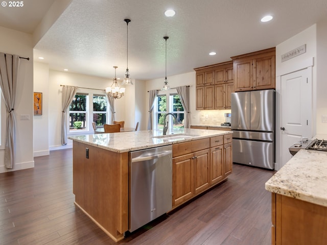 36280 SE Hauglum Rd, Boring, OR 97009 - kitchen featuring appliances with stainless steel finishes, dark wood-style flooring, light stone countertops, recessed lighting, and a textured ceiling