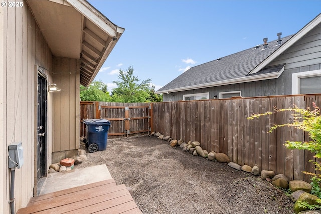 wooden terrace featuring fence