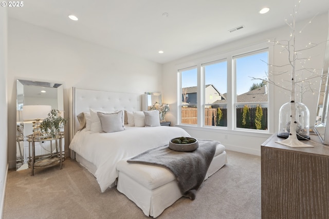 bedroom with light colored carpet