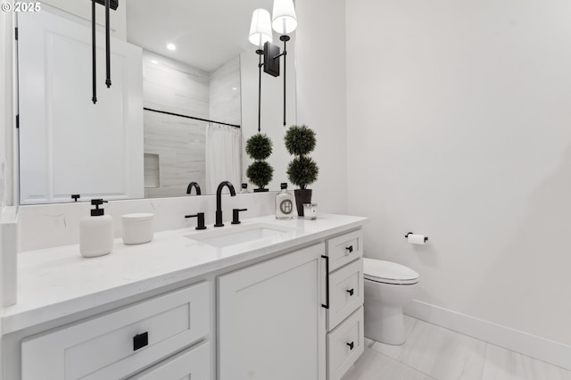 bathroom featuring vanity, toilet, and a shower with shower curtain