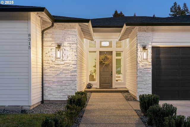 entrance to property featuring a garage