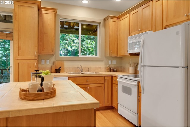 9400 SW 153rd Ave, Beaverton, OR 97007 - kitchen featuring white appliances, tile counters, healthy amount of natural light, recessed lighting, and light wood-style flooring
