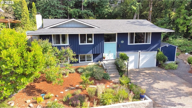 3580 Wilshire Ln, Eugene, OR 97405 - raised ranch with an attached garage, a chimney, a shingled roof, and driveway