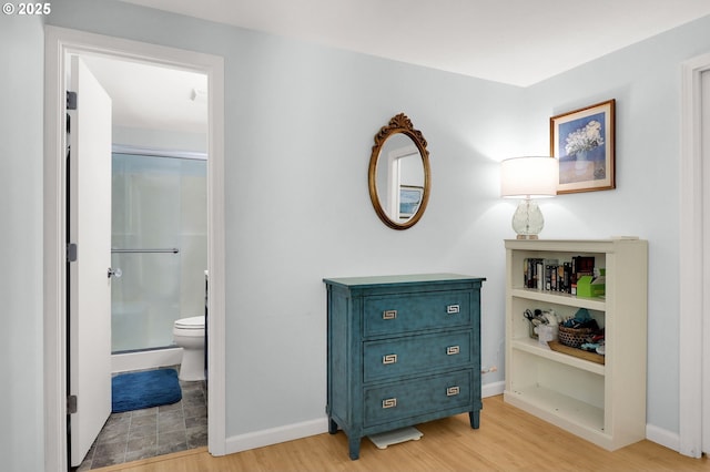 3580 Wilshire Ln, Eugene, OR 97405 - bathroom featuring a stall shower and wood finished floors