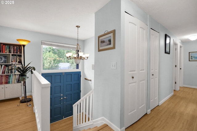 3580 Wilshire Ln, Eugene, OR 97405 - entryway with light wood-style flooring and a chandelier