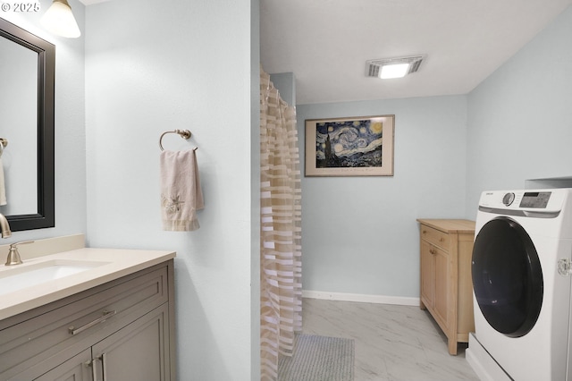 3580 Wilshire Ln, Eugene, OR 97405 - laundry area with washer / dryer and light marble finish floors