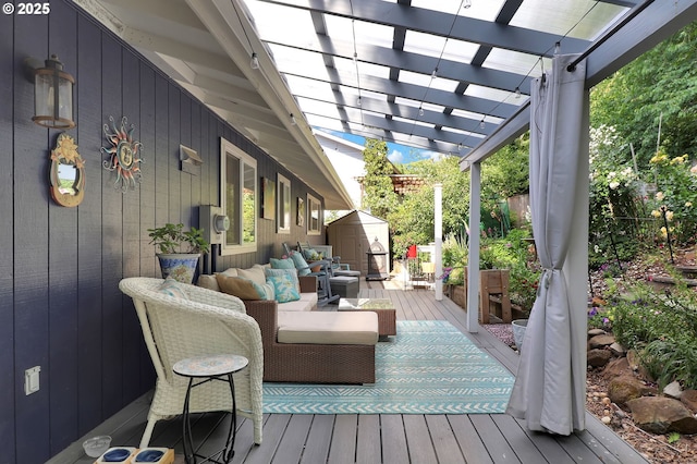 3580 Wilshire Ln, Eugene, OR 97405 - wooden deck with an outdoor living space, a storage unit, and a pergola