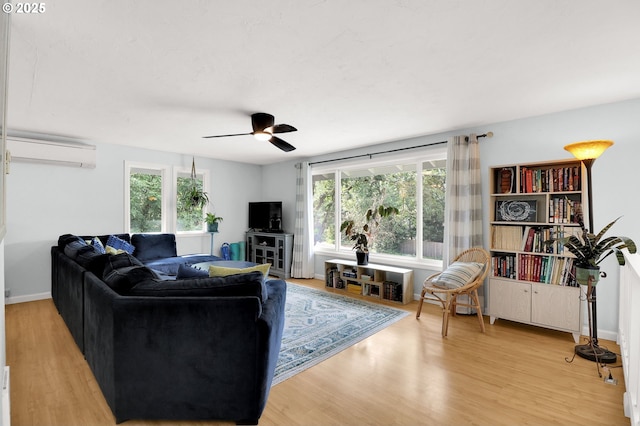 3580 Wilshire Ln, Eugene, OR 97405 - living room with a wall mounted AC, wood finished floors, and a ceiling fan