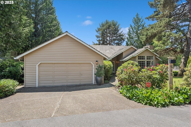 515 SW Colony Dr, Portland, OR 97219 - ranch-style home with an attached garage and a chimney