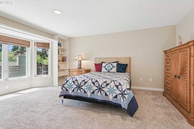 515 SW Colony Dr, Portland, OR 97219 - bedroom featuring light colored carpet and baseboards