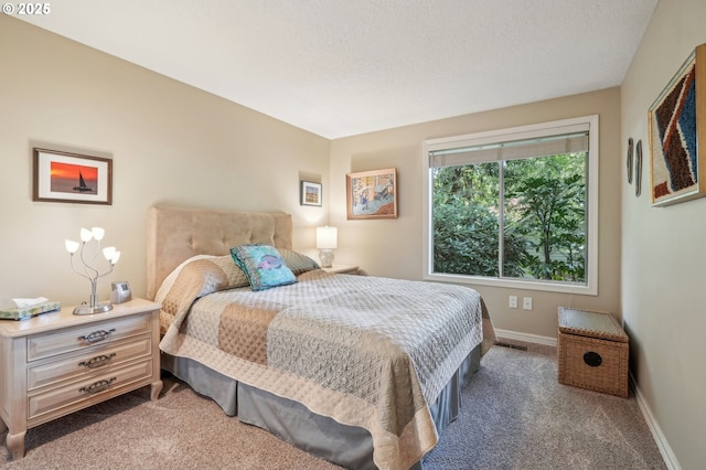 515 SW Colony Dr, Portland, OR 97219 - carpeted bedroom with baseboards and a textured ceiling