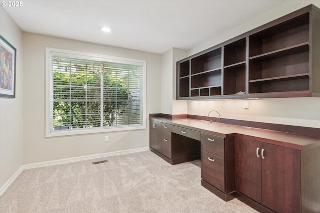 515 SW Colony Dr, Portland, OR 97219 - unfurnished office with light carpet, baseboards, built in desk, and recessed lighting