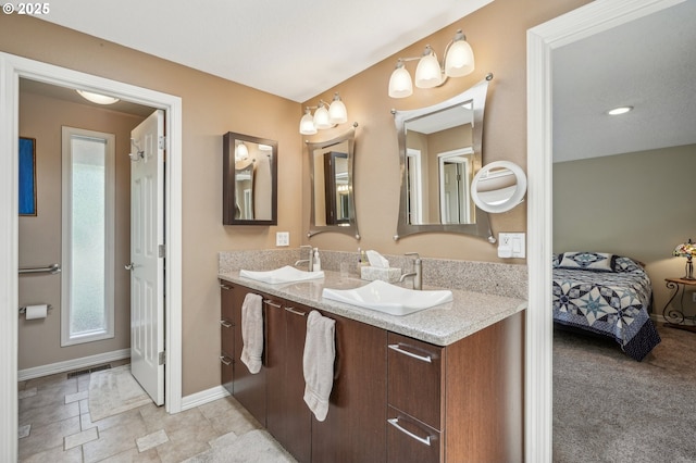 515 SW Colony Dr, Portland, OR 97219 - ensuite bathroom featuring double vanity and baseboards