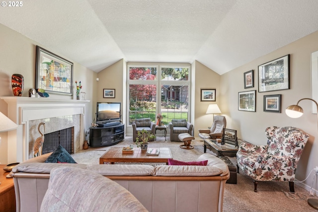 515 SW Colony Dr, Portland, OR 97219 - living room featuring carpet floors, vaulted ceiling, a premium fireplace, and a textured ceiling