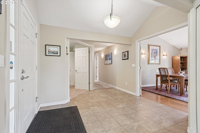 515 SW Colony Dr, Portland, OR 97219 - foyer entrance featuring vaulted ceiling and baseboards