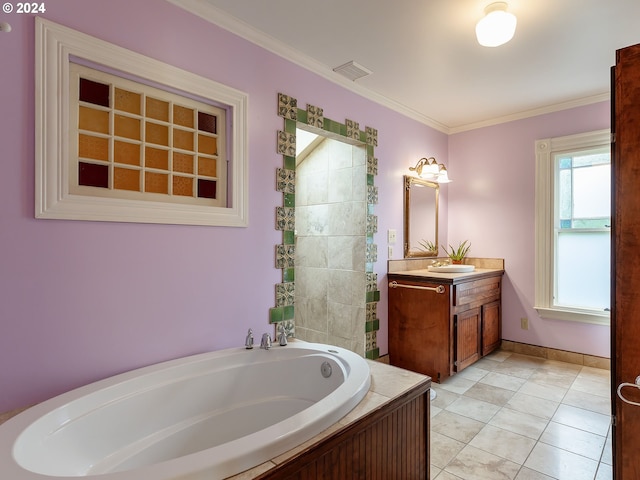 bathroom with vanity, tile patterned flooring, ornamental molding, and a tub