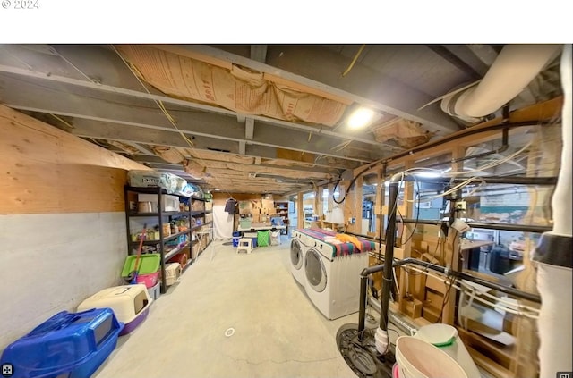 basement with washer and clothes dryer