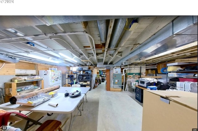 basement with white refrigerator