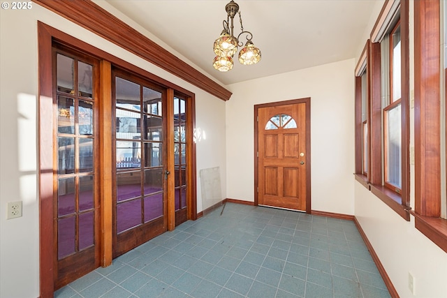 155 N 6th Ave, Elgin, OR 97827 - entryway featuring french doors, baseboards, and a chandelier