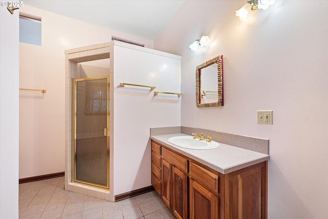 155 N 6th Ave, Elgin, OR 97827 - bathroom featuring a shower stall, vanity, baseboards, and tile patterned floors