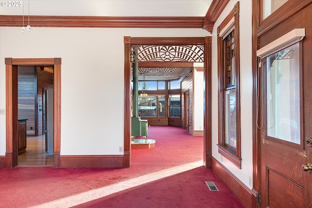 155 N 6th Ave, Elgin, OR 97827 - corridor featuring dark carpet, baseboards, and crown molding