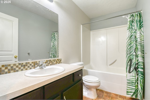 full bathroom featuring shower / tub combo with curtain, tasteful backsplash, vanity, toilet, and a textured ceiling