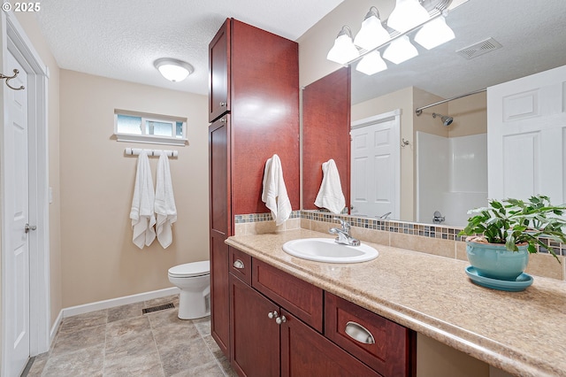 17616 SW Ivy Glenn Dr, Beaverton, OR 97007 - bathroom featuring vanity, a shower, and a textured ceiling