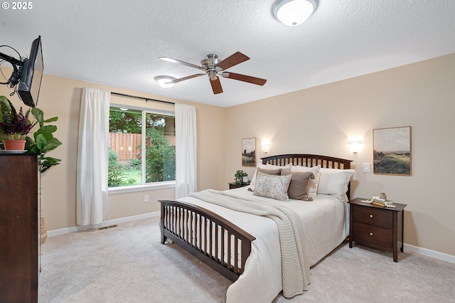 17616 SW Ivy Glenn Dr, Beaverton, OR 97007 - bedroom featuring light colored carpet, a textured ceiling, and a ceiling fan