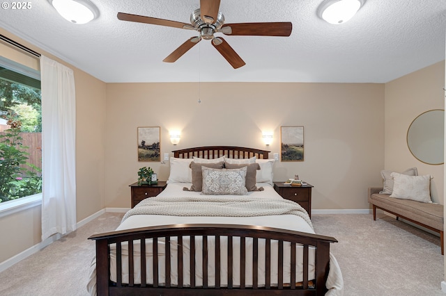 17616 SW Ivy Glenn Dr, Beaverton, OR 97007 - bedroom with light colored carpet, a textured ceiling, multiple windows, and a ceiling fan