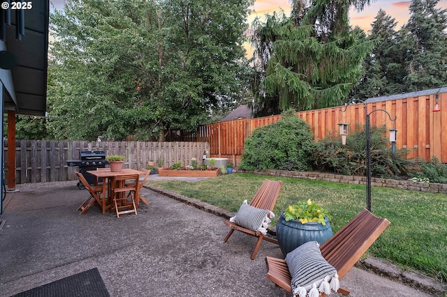 17616 SW Ivy Glenn Dr, Beaverton, OR 97007 - patio terrace at dusk with a patio, a fenced backyard, and area for grilling