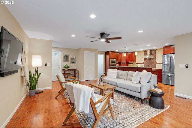 17616 SW Ivy Glenn Dr, Beaverton, OR 97007 - living room featuring a ceiling fan, light wood-style floors, and recessed lighting