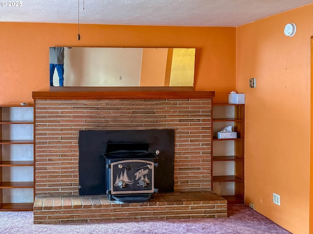 interior details with carpet floors and a fireplace